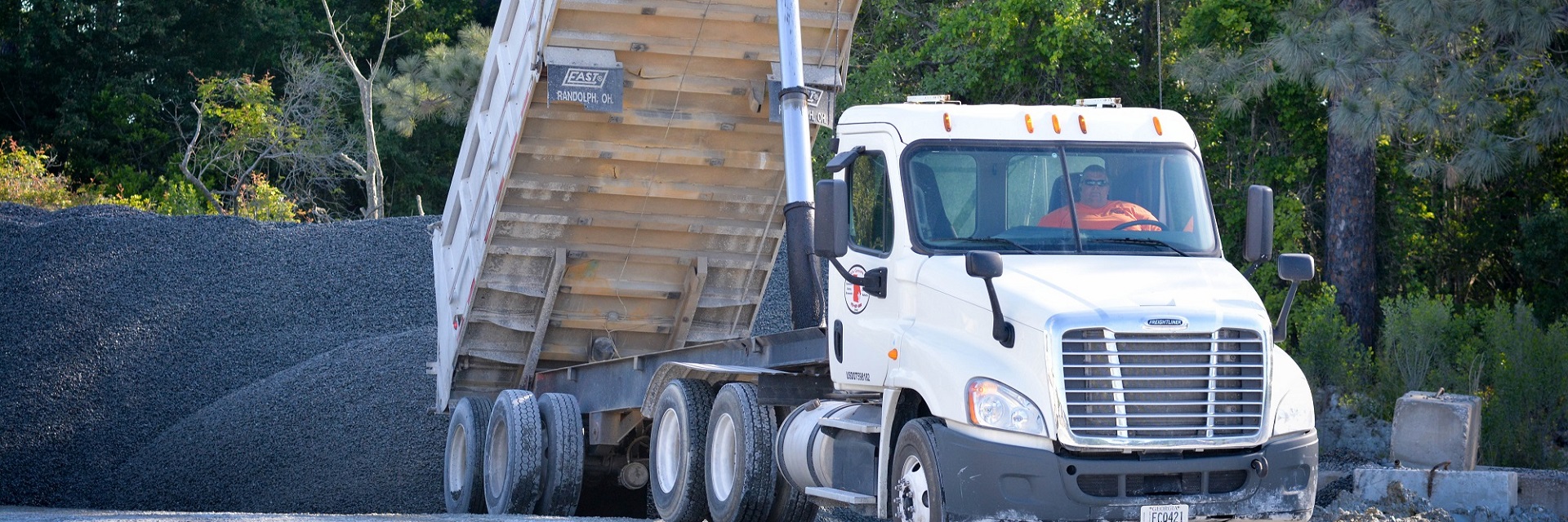 Mobile Concrete dump truck dumping gravel